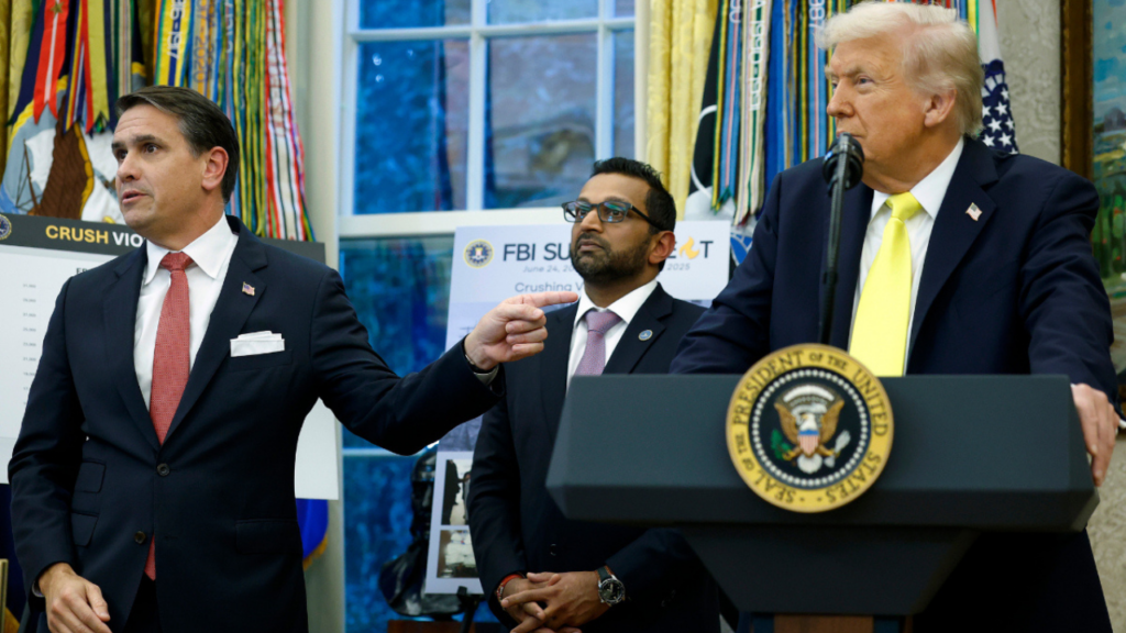 todd blanche pointing to trump. kash patel in background.